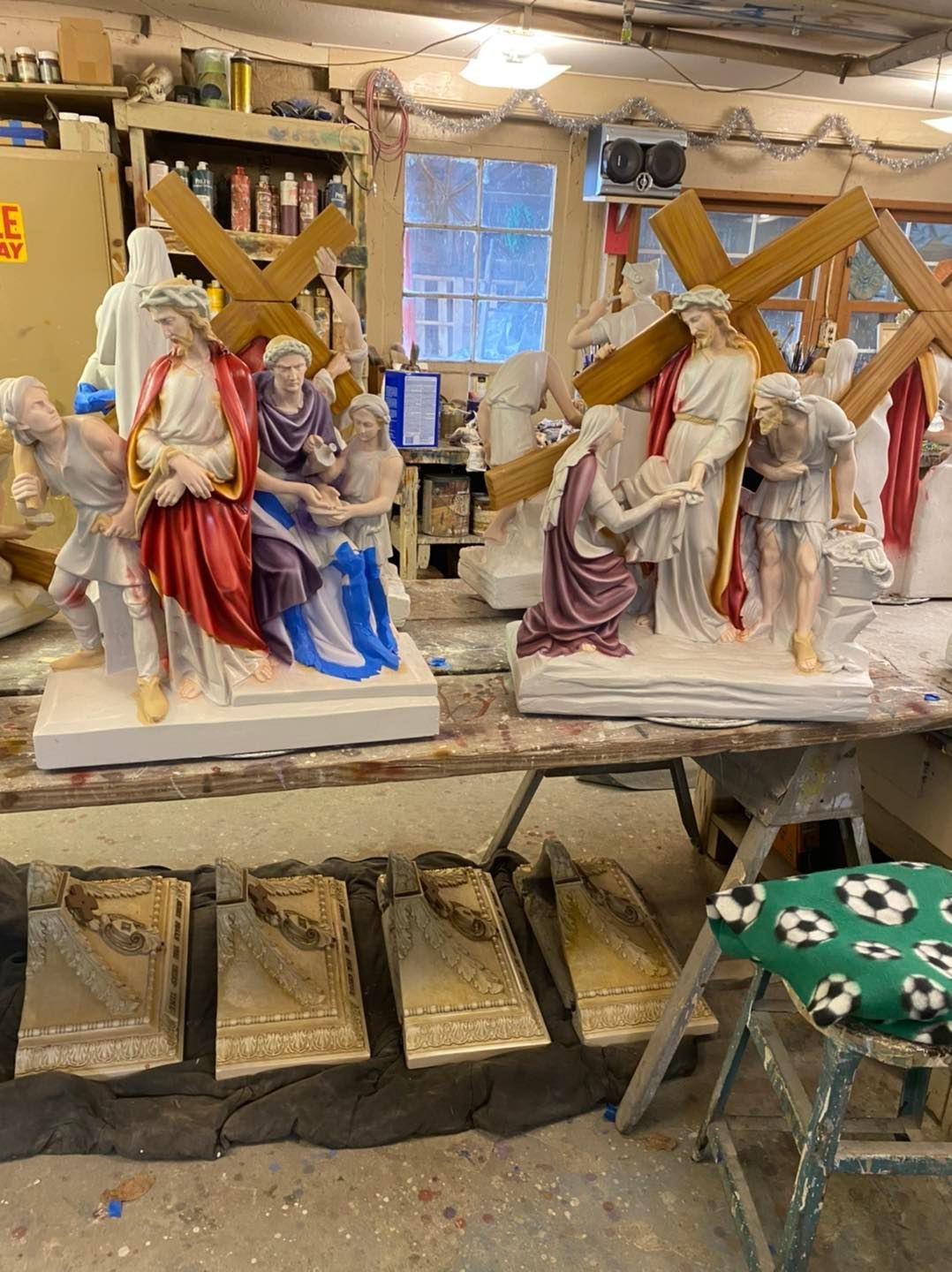 Work commences on restoring the Stations of the Cross from St. Joseph Parish in Palmyra in the studio of Autenrieb Murals & Statue Restoration in Edwardsville, Illinois, in this Jan. 22, 2022, photo.